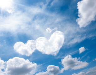 Obraz na płótnie Canvas heart white clouds on blue sky love abstract background. romantic air design concept