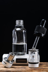 Set of items for an e-cigarette in disassembled form on a table