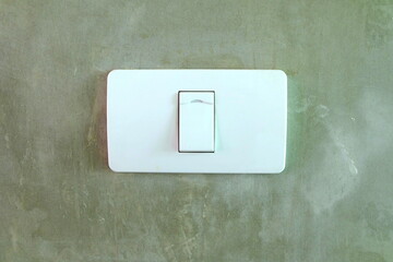 Electric Switch on Concrete Wall.
