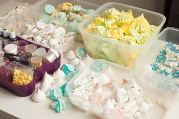 Industrial concept about food, mini colorful meringues in boxes for Confectionary decoration
