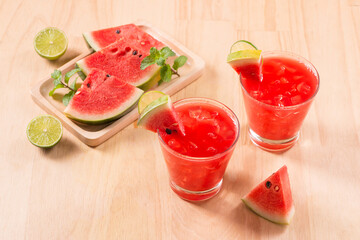 Watermelon drink in glasses with slices of watermelon in summertime