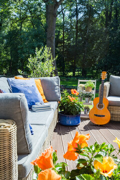 Cozy terrace with flowers and guitar