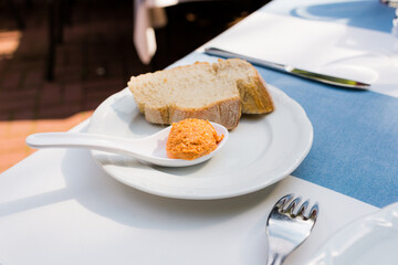 Proper diet food. Homemade chicken or fish liver pate and carrot in a saucer and on bread