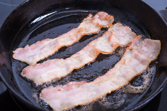 Fried Bacon In A Frying Pan