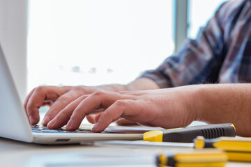 Computer repairman repairing computer laptop