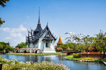Fototapeta na wymiar Amazing view of beautiful Sanphet Prasat Palace with reflection in the water. Location: Ancient City Park, Muang Boran, Samut Prakan province, Bangkok, Thailand. Artistic picture. Beauty world.