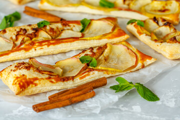 Ruddy puffs with apple, mint and cinnamon. Baking with an apple.