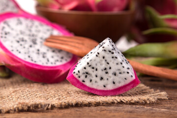 Close up sliced Fresh Dragon fruit or Pitahaya fruit  on the wooden background