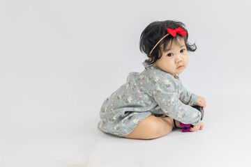 10-month-old Asian girl smiled happily.Healthy children are happy.
