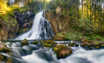 Waterfall with mossy rocks in Golling, Austria