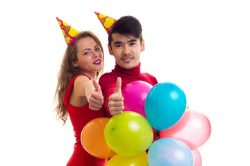 Fototapeta na wymiar Young couple with balloons