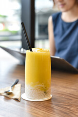 Refreshing mango juice smoothies drink, Mango fruit dessert with jelly, Resting in lifestyle cafe.