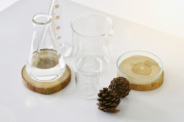 Group of laboratory glassware with natural ingredient for beauty products.