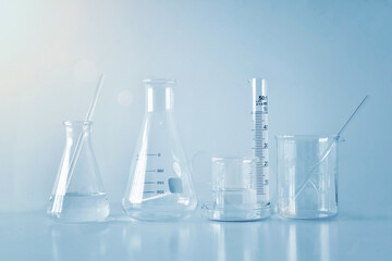 Group of laboratory glassware on table, Symbolic of science research.