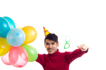 Young man holding balloons