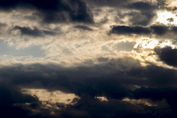 Cumulus clouds with sun rays, dramatic sky