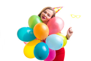 Fototapeta na wymiar Young woman holding balloons