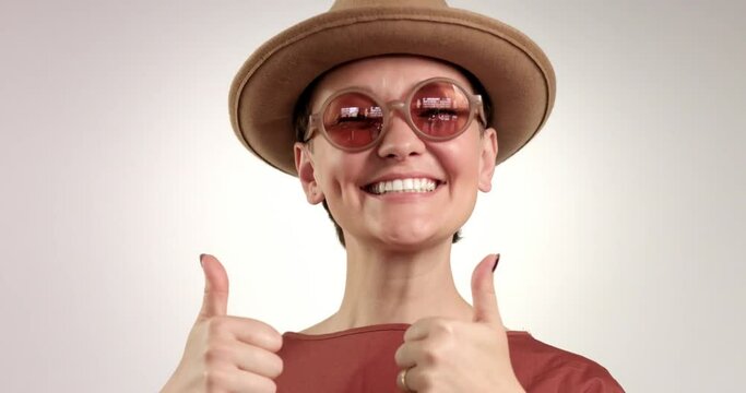 happy smiling woman shows thumbs up