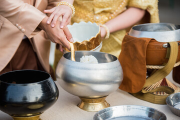 give alms to a Buddhist monk in wedding day, thailand wedding