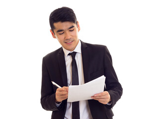 Young man in suit holding papers