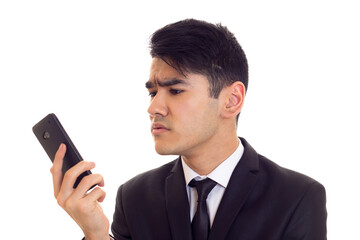 Young man in suit talking on the phone