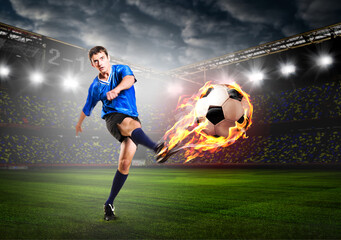 Obraz na płótnie Canvas soccer or football player is kicking ball on stadium