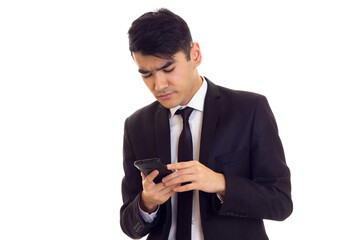 Young man in suit talking on the phone