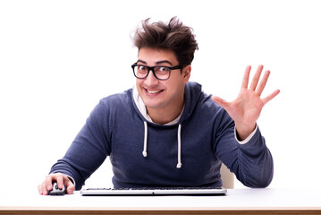 Funny nerd man working on computer isolated on white