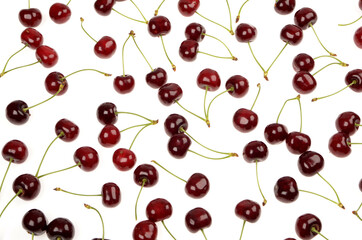Fresh red cherries background texture on an isolated white background