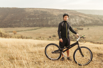 Male posing with mountain bike