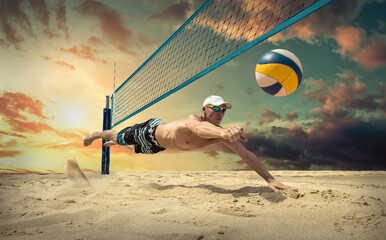 Beach volleyball player in action at sunny day under blue sky.