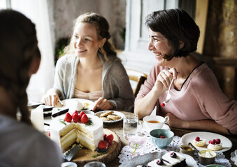 Friends Gathering Together on Tea Party Eating Cakes Enjoyment happiness