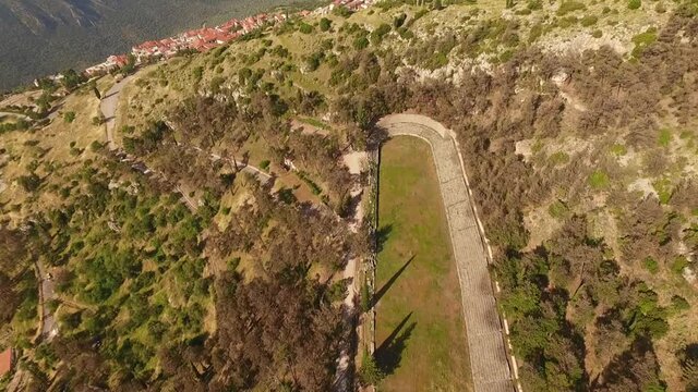 Aerial drone video of arcaheological site of Delphi, temple of Apollo, Greece