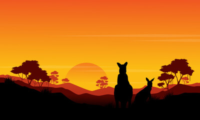 Naklejka premium Silhouette of kangaroo st sunset scenery