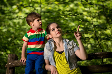 mother and son playing in the forest