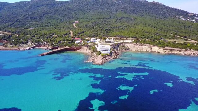 Aerial drone video of seascape in Hamolia with turquoise waters, Porto Rafti, Mesogeia, Attica, Greece