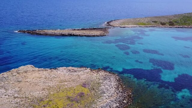 Aerial drone video of seascape in Hamolia with turquoise waters, Porto Rafti, Mesogeia, Attica, Greece