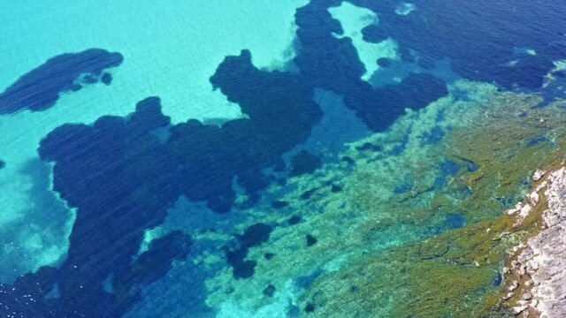 Aerial drone video of seascape in Hamolia with turquoise waters, Porto Rafti, Mesogeia, Attica, Greece
