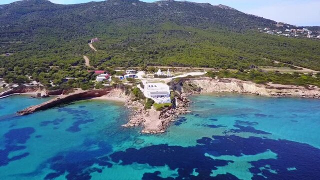 Aerial drone video of seascape in Hamolia with turquoise waters, Porto Rafti, Mesogeia, Attica, Greece