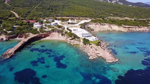 Aerial drone video of seascape in Hamolia with turquoise waters, Porto Rafti, Mesogeia, Attica, Greece