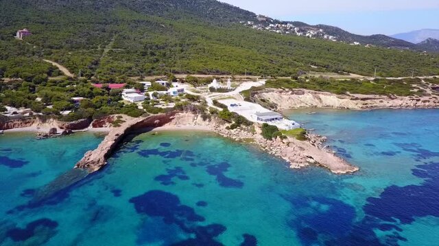 Aerial drone video of seascape in Hamolia with turquoise waters, Porto Rafti, Mesogeia, Attica, Greece