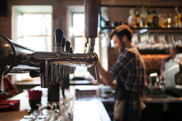 A lot of Golden beer taps at the bar