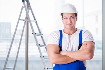 Young worker with safety helmet hardhat