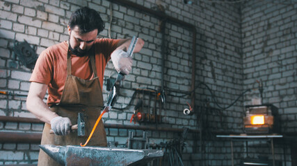 The blacksmith pulls out fire metal detail