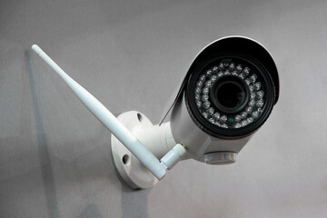 Wireless surveillance camera on the wall of the building