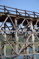 Wooded bridge over the river (Mon Bridge) in Kanchanaburi, Thailand.