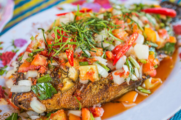 Fish topped with chili