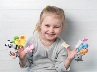 girl with doll puppets on her hands