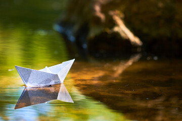 paper boat on the water