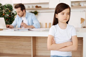 Little daughter looking upset and hurt